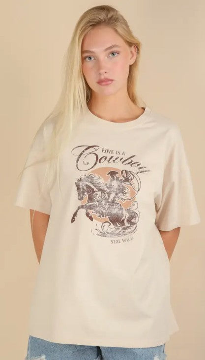 Beige Oversized Cowboy Graphic Knit Top-100 Short Sleeves- Simply Simpson's Boutique is a Women's Online Fashion Boutique Located in Jupiter, Florida