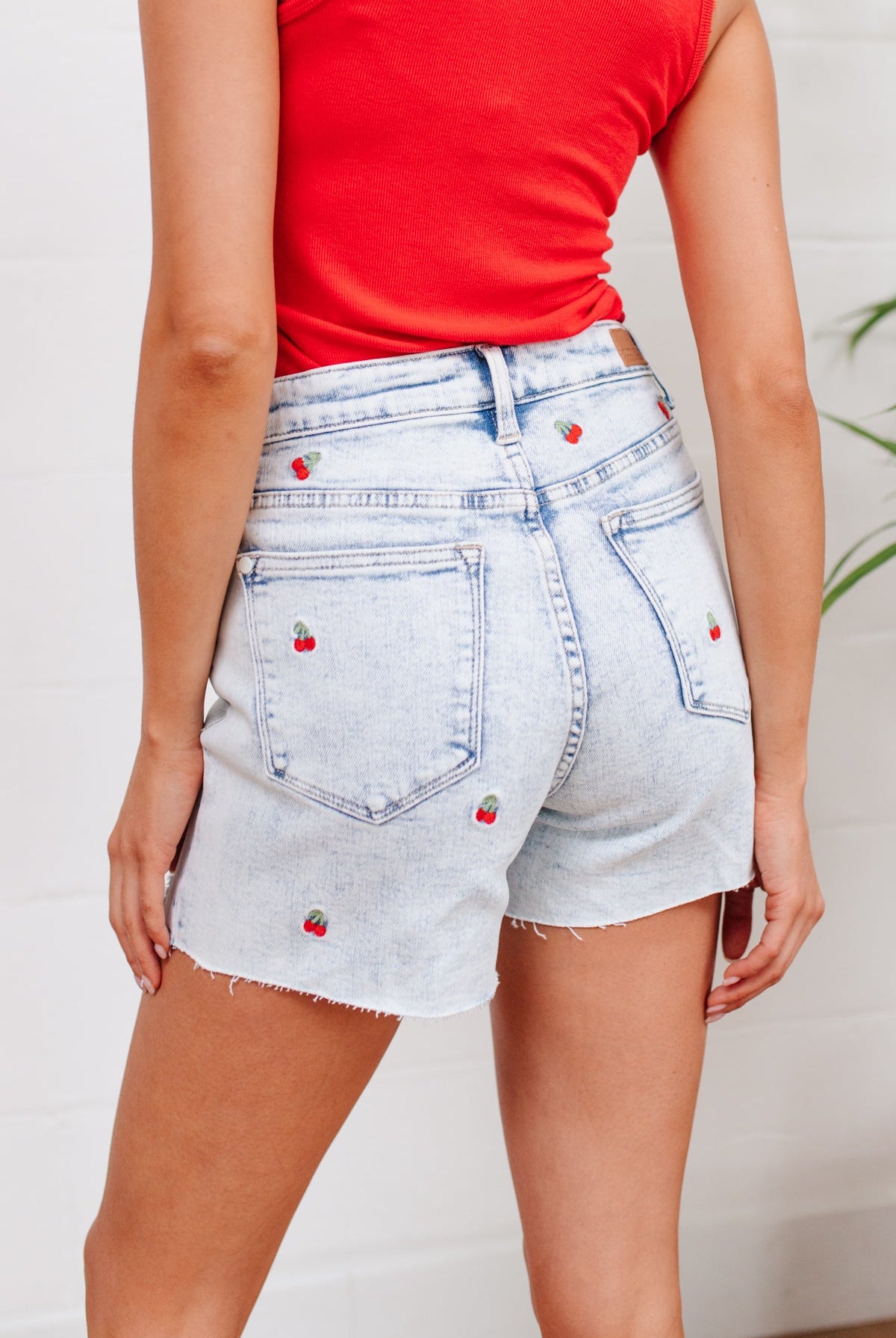 Hi-Waisted Cherry Acid Wash Cutoffs-Jeans- Simply Simpson's Boutique is a Women's Online Fashion Boutique Located in Jupiter, Florida