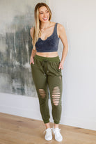 Kick Back Distressed Joggers in Olive-Pants- Simply Simpson's Boutique is a Women's Online Fashion Boutique Located in Jupiter, Florida