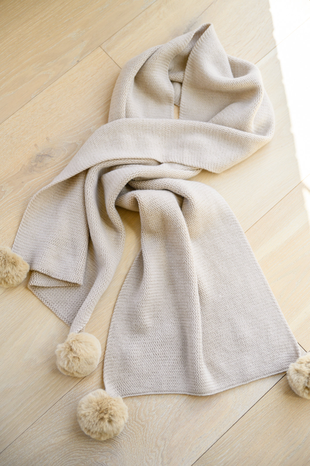 Knitted Fuzzy Pom Pom Scarf In Beige-Outerwear- Simply Simpson's Boutique is a Women's Online Fashion Boutique Located in Jupiter, Florida
