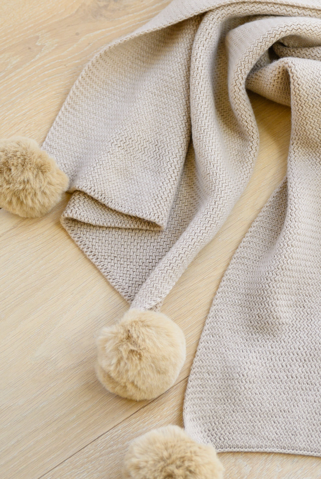 Knitted Fuzzy Pom Pom Scarf In Beige-Outerwear- Simply Simpson's Boutique is a Women's Online Fashion Boutique Located in Jupiter, Florida