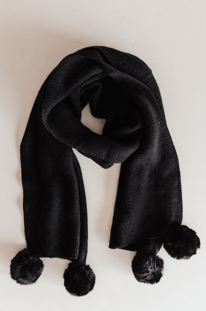 Knitted Fuzzy Pom Pom Scarf In Black-Outerwear- Simply Simpson's Boutique is a Women's Online Fashion Boutique Located in Jupiter, Florida